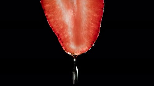 Close Up of Strawberry Slice with Dripping Juice
