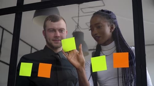 Brainstorming Session With Sticky Notes in Modern Office