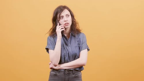 Cheerful Woman Receives Good News on Phone Call