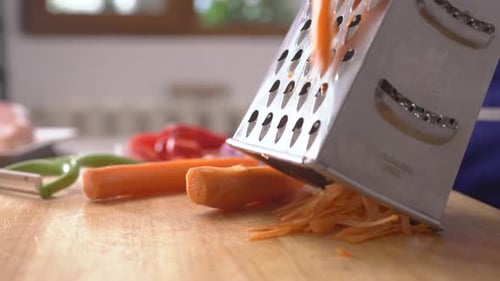 Grating a Carrot in Bright Kitchen Setting