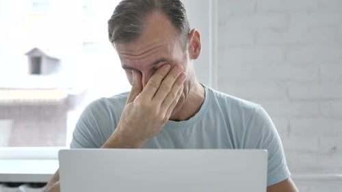 Tired Man at Work