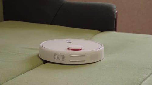 Robotic Vacuum Cleaning Green Couch