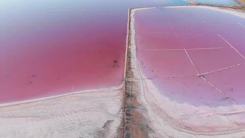 Wonderful Flight Over a Pink Salty Lake at Sunset in the Evening