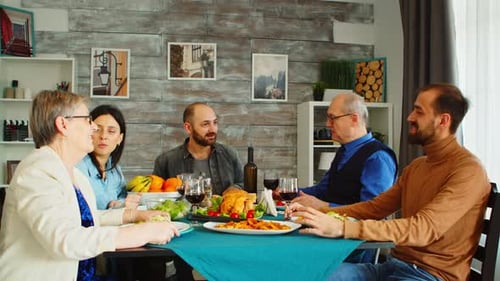Family Gathered Around a Table for Mealtime