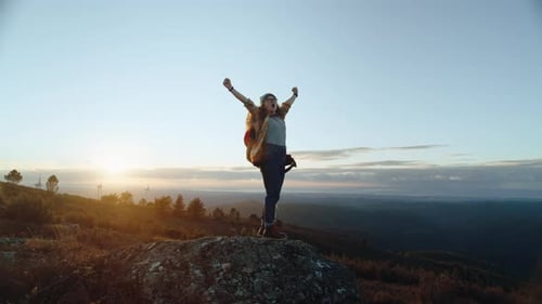 Woman Hiker on Adventure Trip in Mountain Sunset