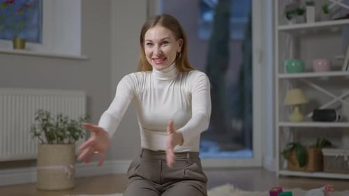 Portrait of Happy Young Woman Clapping As Little Girl Walking to Mother in Slow Motion Hugging