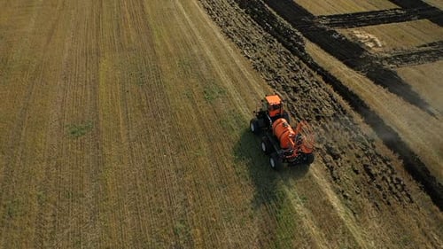 Machine with the Attached Equipment Goes Through the Field