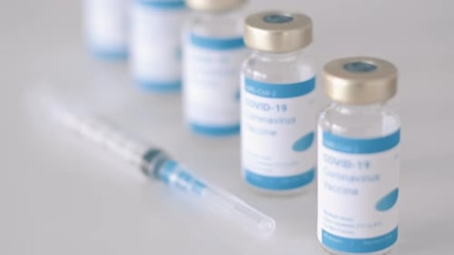 COVID-19 Coronavirus Vaccine Vials and Syringe