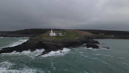 Lighthouse On The Shore