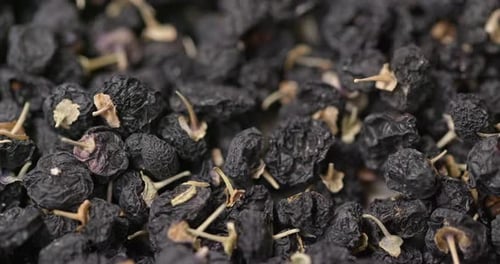 Heap of Dried Black Goji Berries Close Up