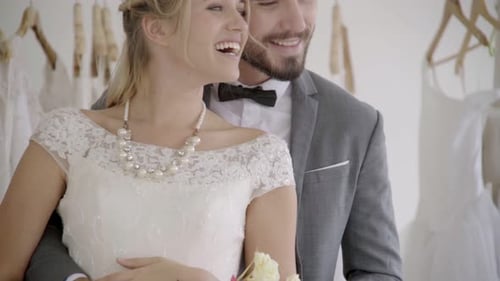 Elegant Couple at Wedding Dress Shop