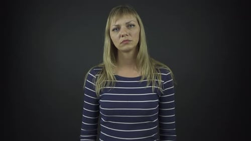 Woman Giving Blank Stare in Studio Setting