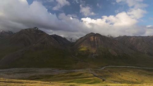 Scenic Mountain Landscape with River and Clouds