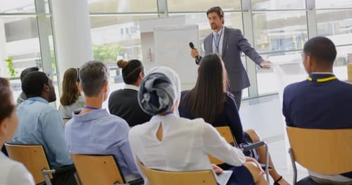Corporate Presentation by Man to Audience Indoors