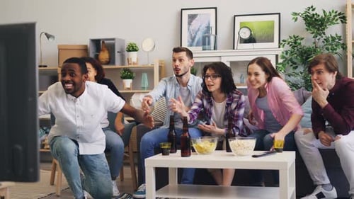 Friends Cheering and Celebrating at Home