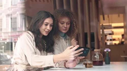 Two Friends Making Selfie in Restaurant