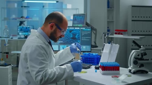 Scientist Pipetting Sample in Modern Laboratory Environment