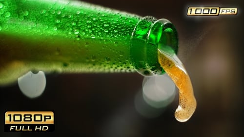 Refreshing Green Bottle Pouring Beer Close Up