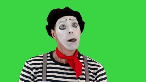 Mime Artist hält imaginäre Luftballons und fliegt auf einem Greenscreen-Chroma-Key