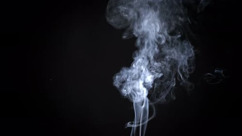 Abstract White Smoke Rising Against Black Background