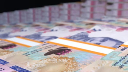 Many wads of money background. 200 Ukrainian Hryvnia banknotes. Stacks of money.