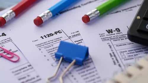 Close Up of Tax Forms with Office Supplies