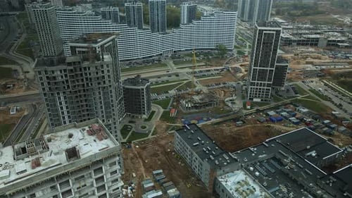 Construction of modern multi-storey buildings. Construction of a new city block.