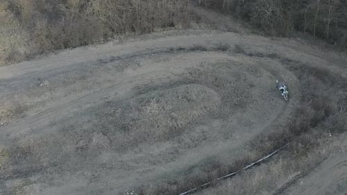 Aerial view of a motocross rider on a dirt track