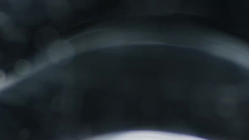 Abstract Gray Background with Rippling Light Effects