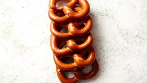 Row of Fresh Baked Brown Salty Pretzel Bread