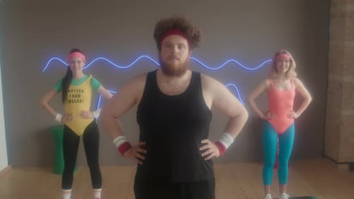 Three Individuals in 80s Fitness Attire Posing