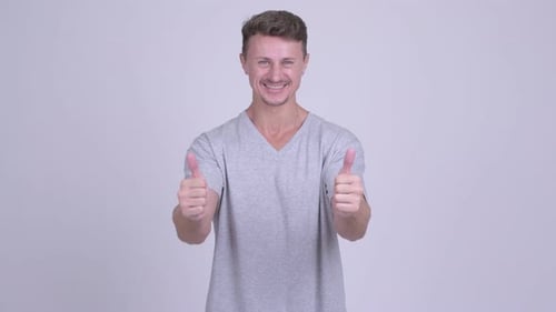 Smiling Man Gives a Double Thumbs Up