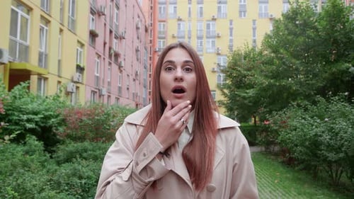 Surprised Woman Reacts with Facial Expressions Outside