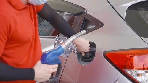 Close up of car fueling process at gasoline petrol station, refuel petroleum oil and energy vehicle