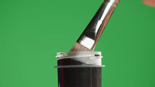 Black Paint Isolated on Green Background