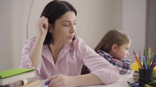 Portrait of Sad Caucasian Woman Looking Back at Disobedient Daughter and Signing. Tired Parent