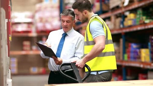 Warehouse Worker Talking with his Manager