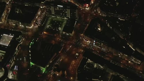 AERIAL: Slow Overhead Shot of City at Night with Lights and Traffic, Cologne, Germany