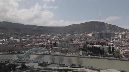 Tbilisi, Georgia - April 2 2021: Aerial view of Tbilisi city central park and Bridge of Peace.