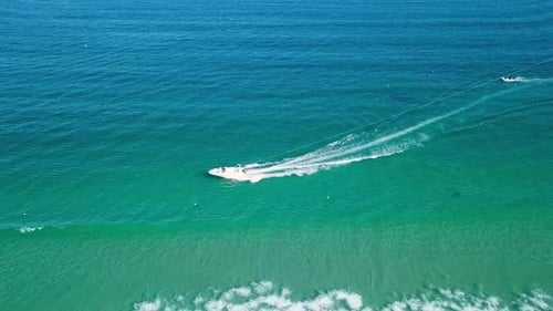 Tourists Parasailing Over Sea Coastline, Drone Point View.
