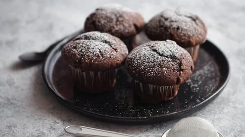 Fresh and Tasty Chocolate Muffins Served on Plate