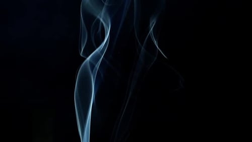 Abstract Light Blue Smoke on Black Background