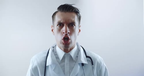Angry Doctor Shouting and Pointing a Finger