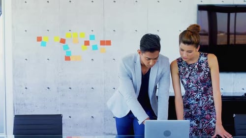 Young Adults Collaborate in Modern Office Setting