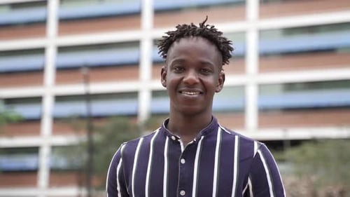 Portrait of Young Happy African American Man Smiling in the City