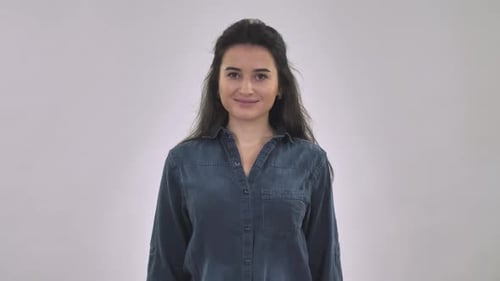 Young Woman Smiling Giving Thumbs Up Gesture