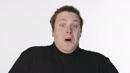 Man Reacts with Surprise in Close Up Shot