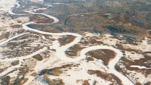 Beautiful Snowy White Forest And Curved Frozen Snow Covered River In Winter Frosty Day