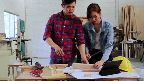 Teamwork in Woodworking Shop Crafts Wooden House