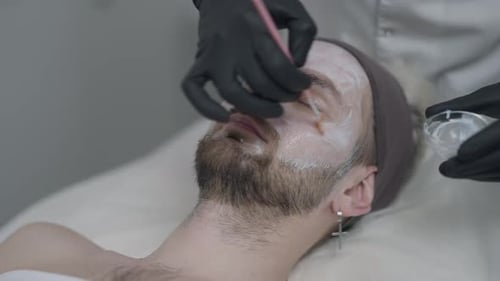 Man Receives Facial Treatment at Spa